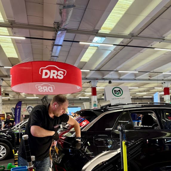 Miro working on a complex dent during the competition