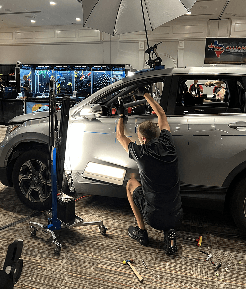 Technician working with precision tools on vehicle repair